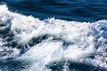 White crest of a sea wave. Selective focus. Shallow depth of field