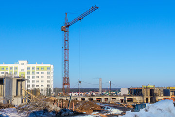 Fototapeta na wymiar construction of a multi-storey residential building using the method of monolithic construction using a tower crane