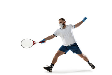 Beat the disease. Male tennis player in protective mask and gloves. Prevention against pneumonia. Still active while quarantine. Chinese coronavirus treatment. Healthcare, medicine, sport concept.