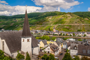 Panoramic views of the villages of Kaimt and Zeel, with traditional houses for the Moselle river district, the two Catholic churches and vineyards on a hill.