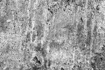 Texture of a concrete wall with cracks and scratches which can be used as a background