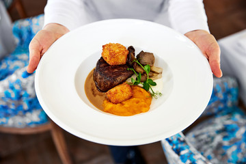Filet mignon, fried brie cheese, pepper sauce and pumpkin puree