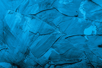 Textured plastered background with a variety of arbitrary stains. Blue. Toned