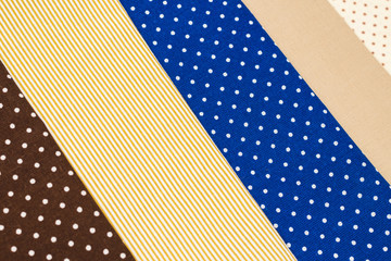 Mix of beige, white and brown cotton fabric.