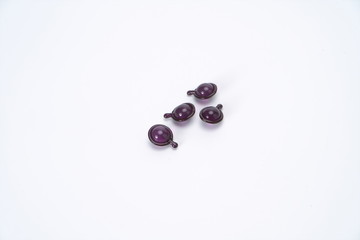 Purple water drop shape fragrance in the white background, it has charming fragrance and is used as fragrance, which can be carried with you. Successful people and women like it very much