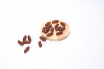 The taupe capsule is isolated in the white background