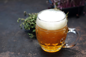 Beer in a mug. A light beer with beer foam.