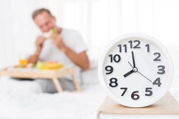 Medium shot blurred man having breakfast in the morning
