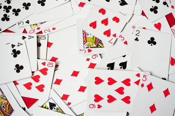 Assorted play cards and combinations on isolated white background close up view
