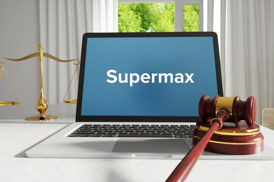 Supermax &ndash; Law, Judgment, Web. Laptop in the office with term on the screen. Hammer, Libra, Lawyer.