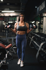 Fitness woman on training. Young woman in the gym.