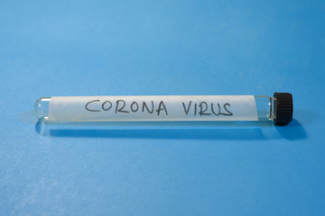 Test tube with a label of Corona virus Covid-19 on blue background Global epidemic