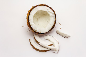 Ripe coconut cut on two half isolated on white background