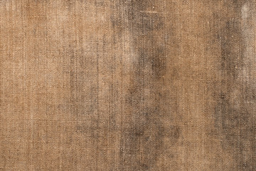 Naklejka na ściany i meble Background of rough old burlap. Coarse cloth