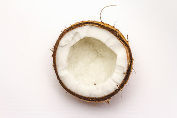 Ripe coconut cut on two half isolated on white background