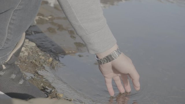 Guys hand in water