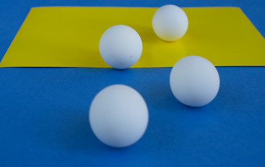 White eggs on blue and yellow background