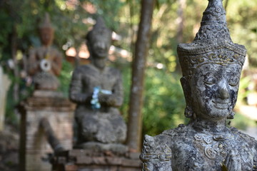 Fototapeta na wymiar Row of Praying Statues, Foreground in Focus, Pha Lat Temple, Doi Suthep, Chiang Mai
