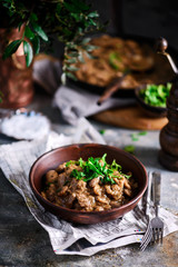 Chicken hearts with onions and mushrooms.