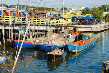 Fototapeta na wymiar Fishing boats moored at the market