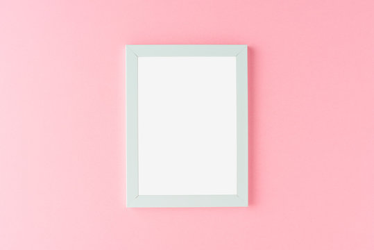 Blue Picture Frame On Pink Background. Mockup With Copyspace