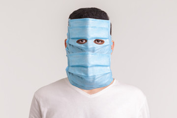 Protection against contagious disease, coronavirus. Man wearing hygienic mask to prevent infection,...