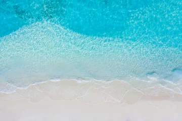 Foto op Aluminium Summer seascape beautiful waves, blue sea water in sunny day. Top view from drone. Sea aerial view, amazing tropical nature background. Beautiful bright sea with waves splashing and beach sand concept © icemanphotos