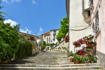 A narrow street between the old houses of a medieval village in Abruzzo
