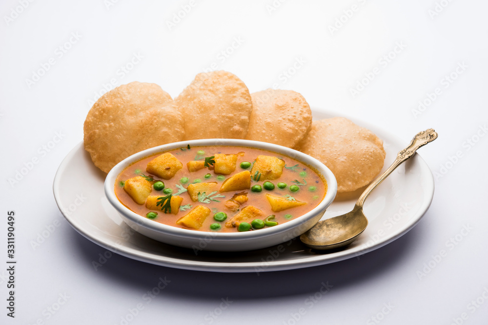 Canvas Prints aloo puri or potato curry with fried poori, popular indian breakfast / lunch / dinner menu.