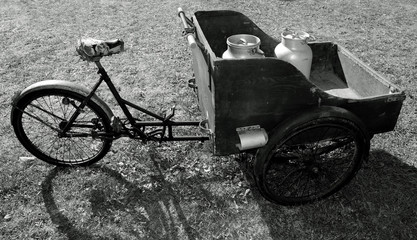 bike with milk canister used once a long time ago with black and