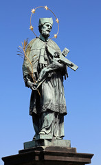 Fototapeta premium statue of Saint John o who holds the crucifix in his hands
