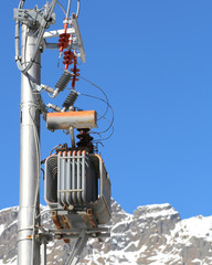 pole with electric transformer and high voltage electrical cable