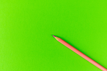 Color pencils on the green background.