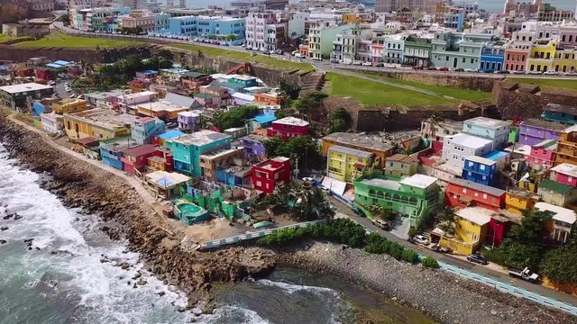 Aerial, drone shot panning over colorful buildings, at the La Perla area, in San Juan, Puerto Rico, USA