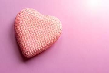 The photo shows a heart on a pink and purple background, the color of the 2020 trend. Photo shows that Valentine's day is over, love during the quarantine due to the virus. advertising space