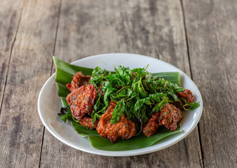 Fried fish cake with basil leaves