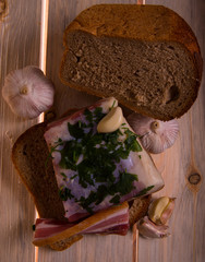 Salted lard, honesty, gray bread, still life, on wooden background