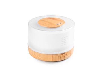 Isolated aroma humidifier. Wellbeing concept. Wood and white