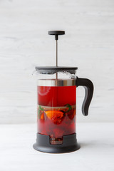glass teapot with fruit tea . menu