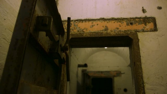 The old underground corridor/tunnel with metal rusty doors