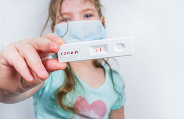Worldwide coronavirus epidemic concept. Pandemic COVID-19, 2019-nCoV. Kid girl with positive test...