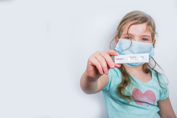 Worldwide coronavirus epidemic concept. Pandemic COVID-19, 2019-nCoV. Kid girl with positive test...
