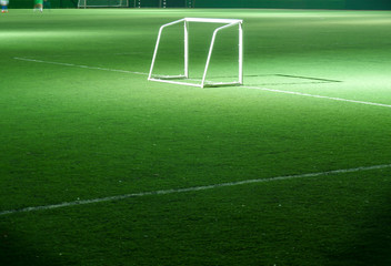 Football or Soccer Field with the Goal Post in the Night Time.