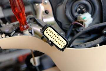 Fototapeta na wymiar Motorcycle repair technicians check the wiring or repair of the motorcycle.