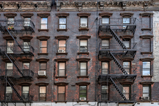 ancient brick buildings with fire stairs - Powered by Adobe