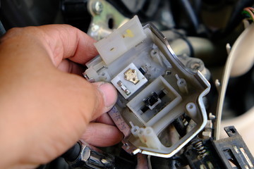 Motorcycle repair technicians check the wiring or repair of the motorcycle.