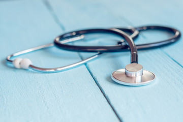 Medical stethoscope on a blue background close up