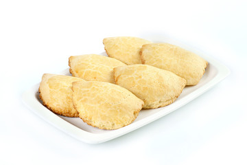 Russian pies with cottage cheese on a white background
