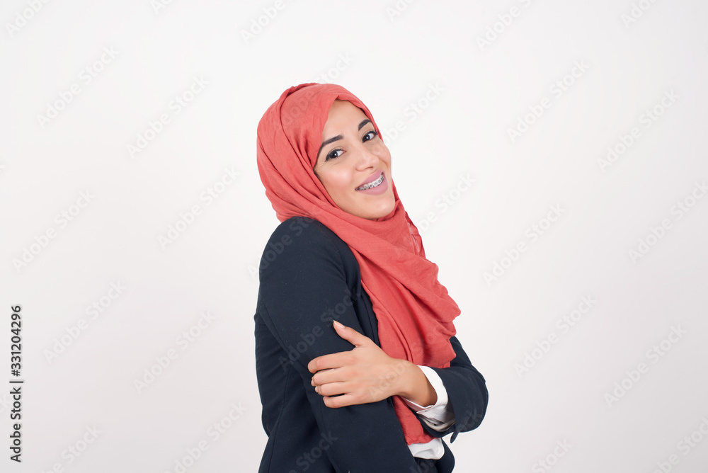 Wall mural People, lifestyle, youth and happiness concept. Shy pretty girl with shaggy black hair and dark skin, feeling happy after boy who she likes invited her out on date.