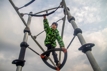 A teenage boy is engaged in sports, plays at the sports complex for adults.